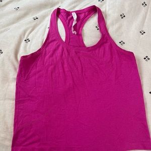 Lululemon Swiftly Race Length tank size 12. Pink fuchsia.